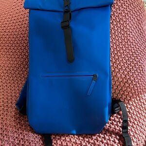 Rains minimalist royal blue rolltop backpack